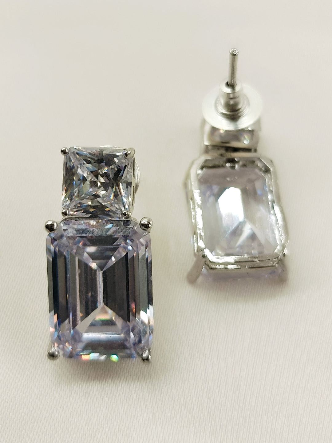  Stunning pair of Rohini White American Diamond Tops featuring timeless design and genuine American diamonds, perfect for adding a touch of elegance to any style