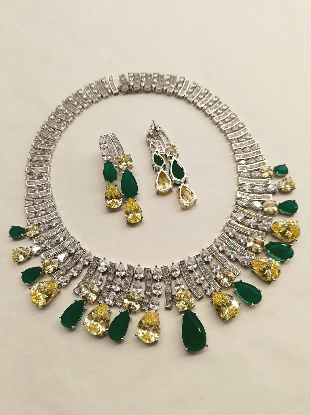 Gold necklace adorned with clementine American diamond pendant and matching earrings