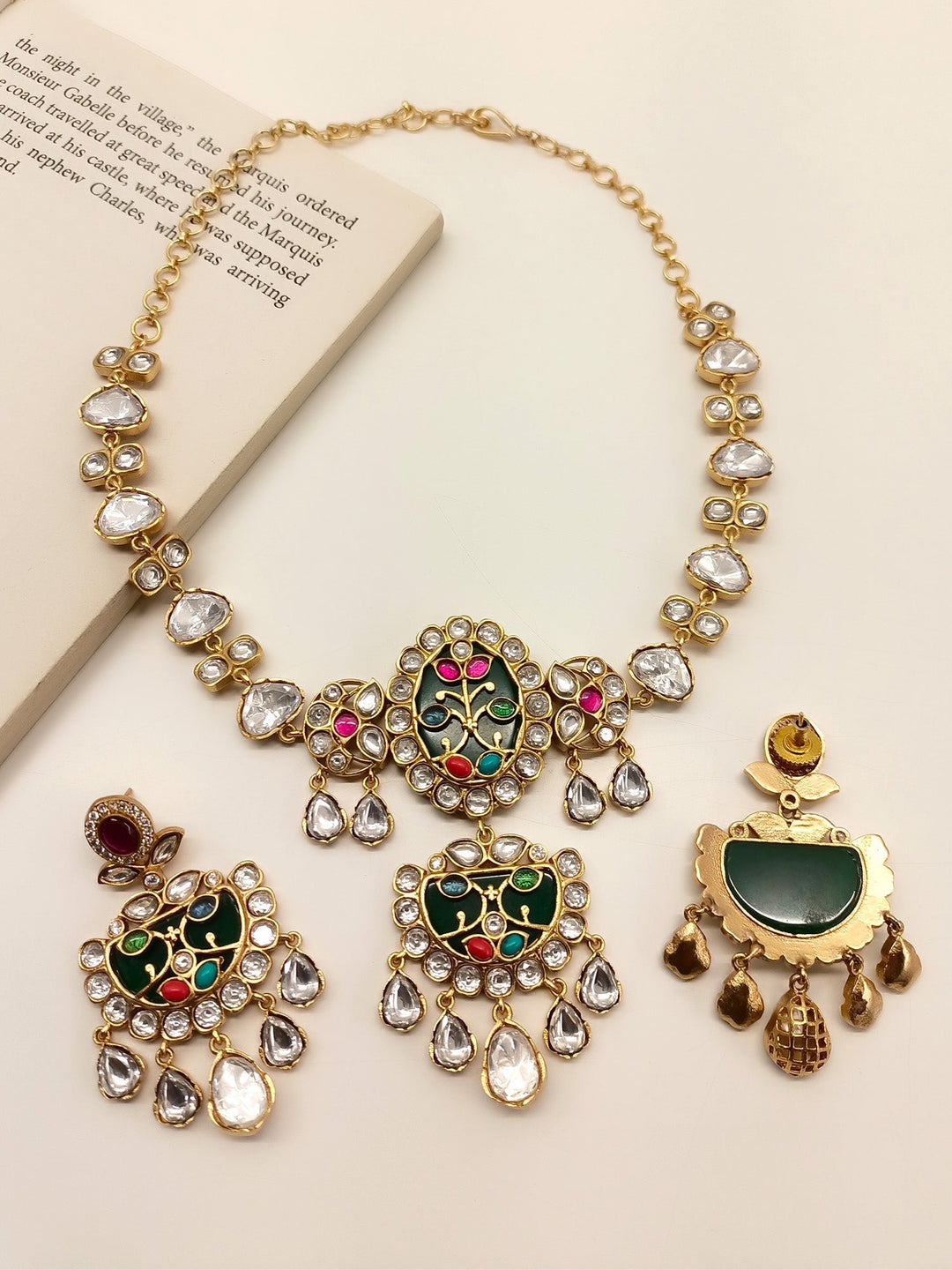 Stunning Yessa Multi Colour Boutique Choker Set crafted with gold plated brass metal and polki, finished off with natural pearl for a gorgeous look
