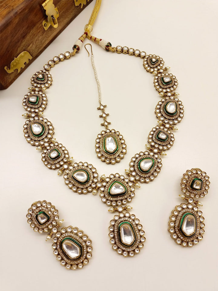  Green Polki Necklace Set, made from high quality antique gold plated brass metal, adorned with beautiful pearls and American diamond setting, a must-have for a memorable bridal experience