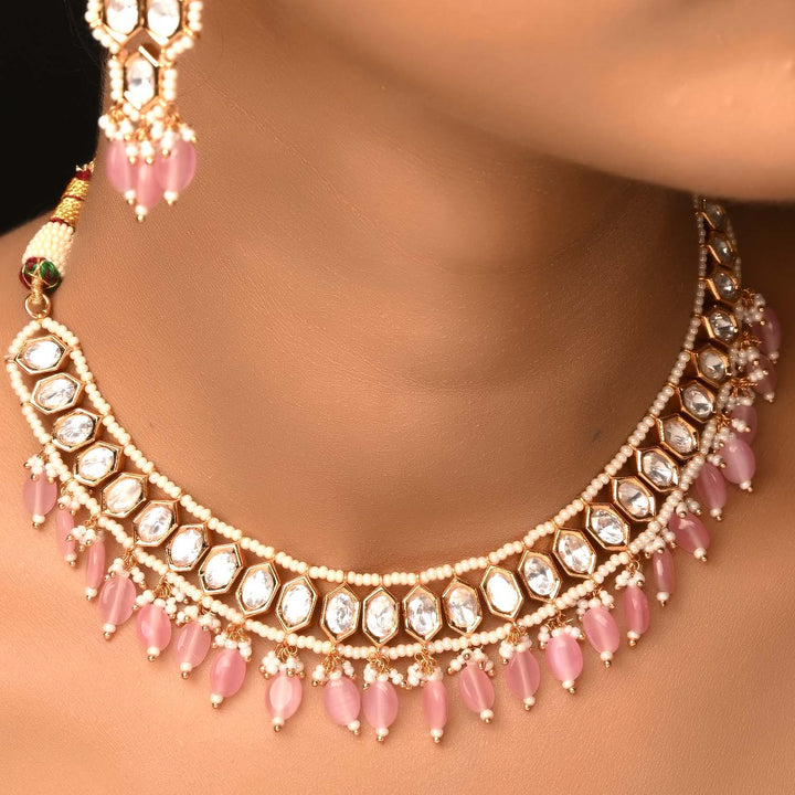  Traditional and stylish gold plated brass metal Kundan set with pink stones hangings and long danglers 