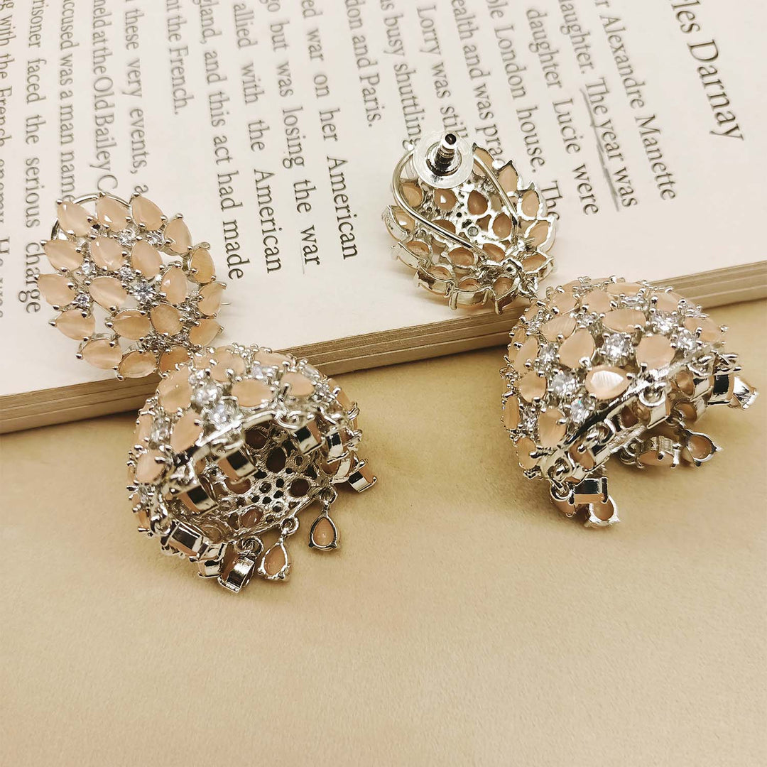 Beautiful peach-colored silver-plated jhumki earrings with sparkling American diamond accents