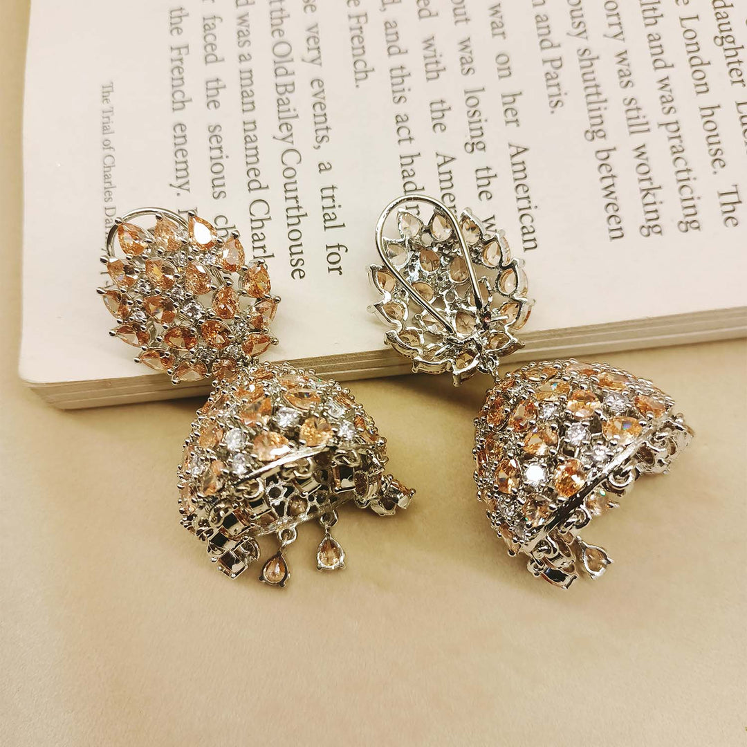 Exquisite jhumki earrings featuring American diamond and pear-shaped copper stone
