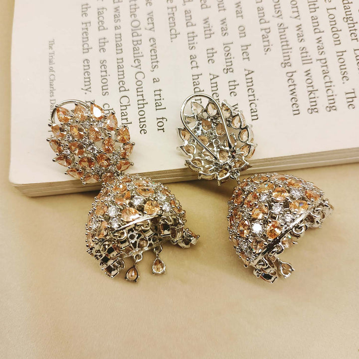 Exquisite jhumki earrings featuring American diamond and pear-shaped copper stone