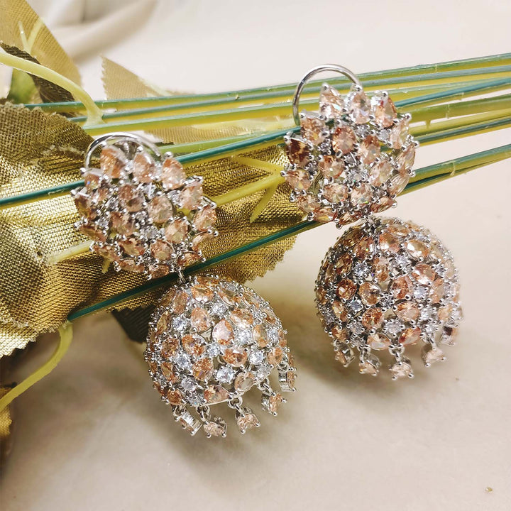 Stunning silver plated jhumkas adorned with American diamond and copper stone