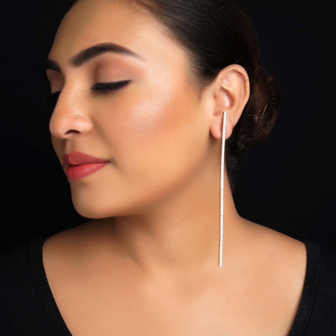 Long rose gold plated danglers with American diamond embellishments 