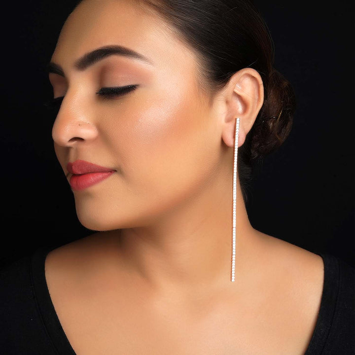 Long rose gold plated danglers with American diamond embellishments 