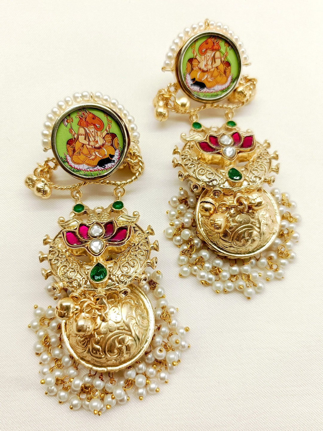 Handcrafted intricate gold and silver Jhumki earrings from Nova M & G Boutique
