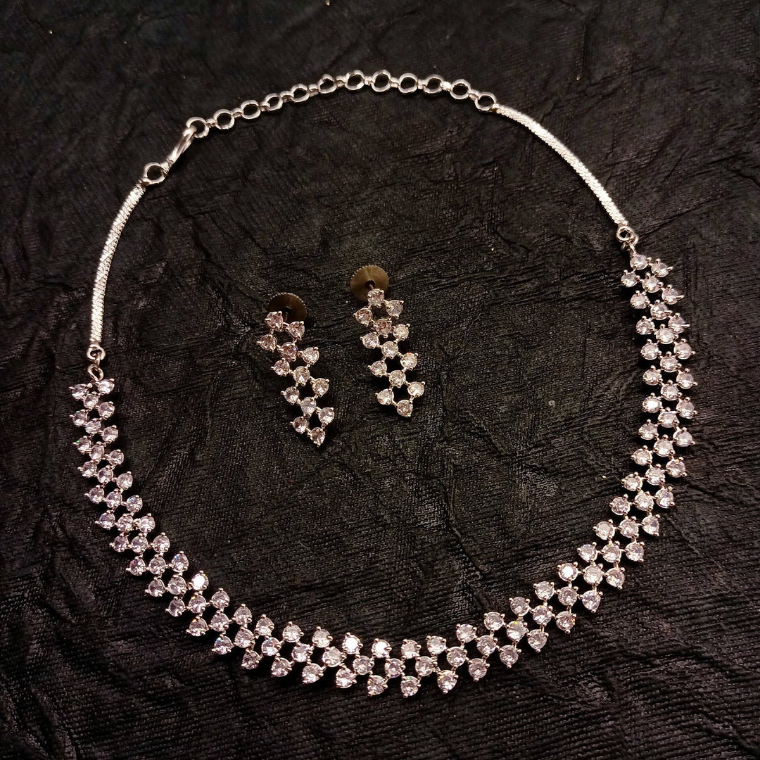  Detailed shot of Tejaswini Silver Plated Semiprecious White Stone American Diamond set showcasing intricate silver plating on brass metal