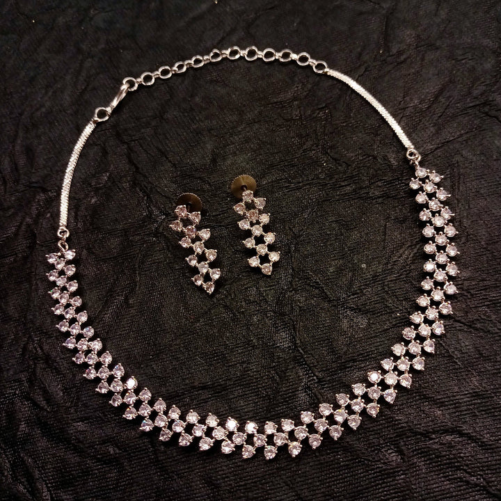  Detailed shot of Tejaswini Silver Plated Semiprecious White Stone American Diamond set showcasing intricate silver plating on brass metal