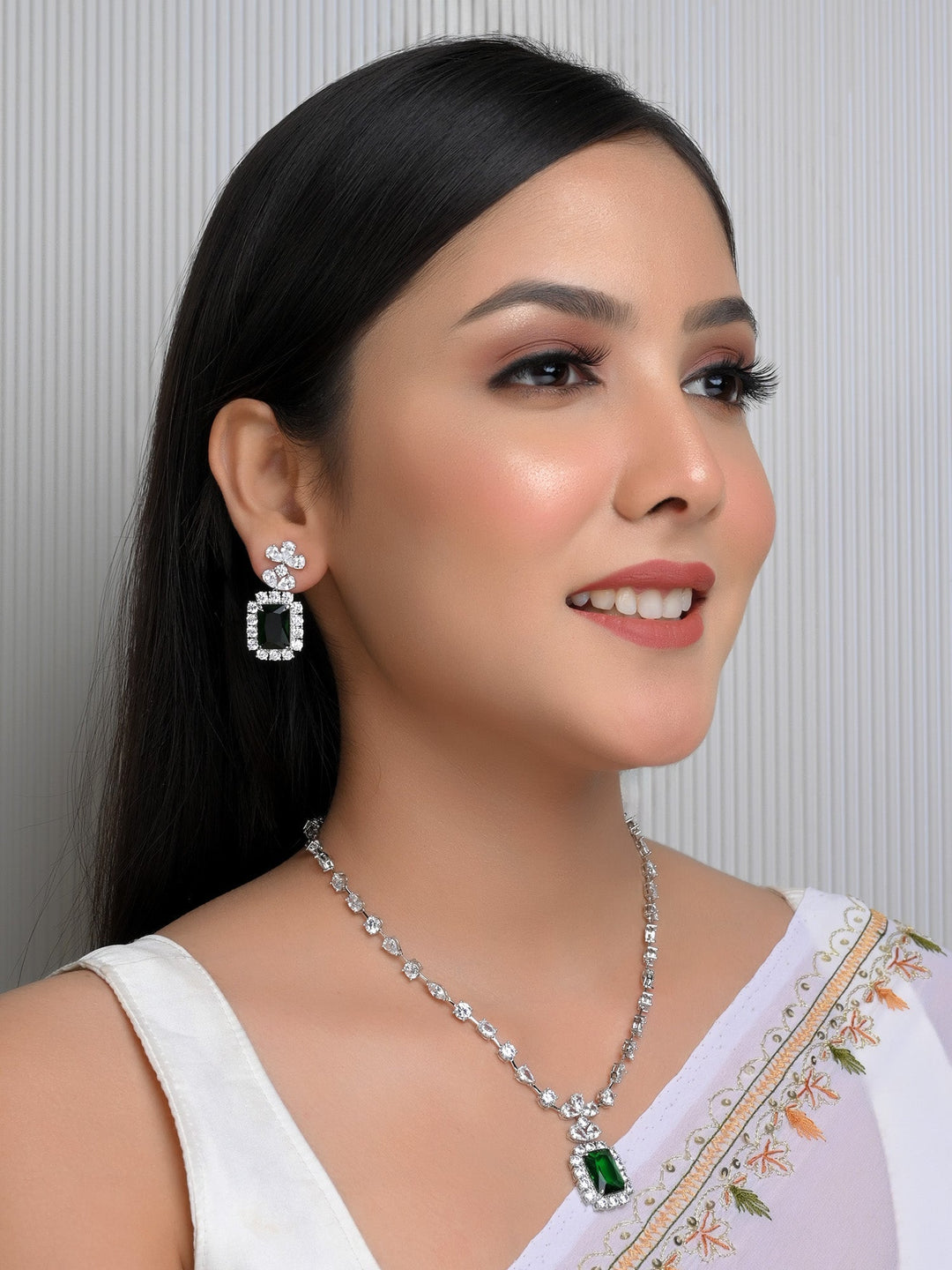 Beautiful Reet Green American Diamond Set necklace and earrings on display