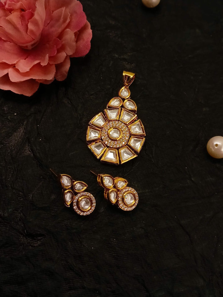  Intricately designed Purnima White Kundan Pendant Set featuring stunning Kundan setting and brass metal tops with gold plating