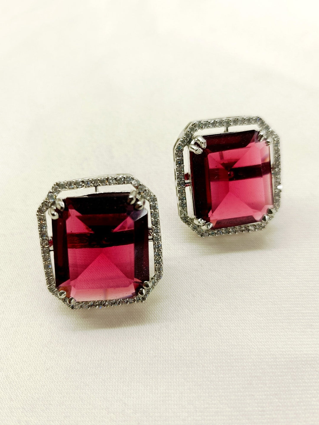  Elegant and stylish tops featuring American diamonds and a striking rose pink sapphire stone
