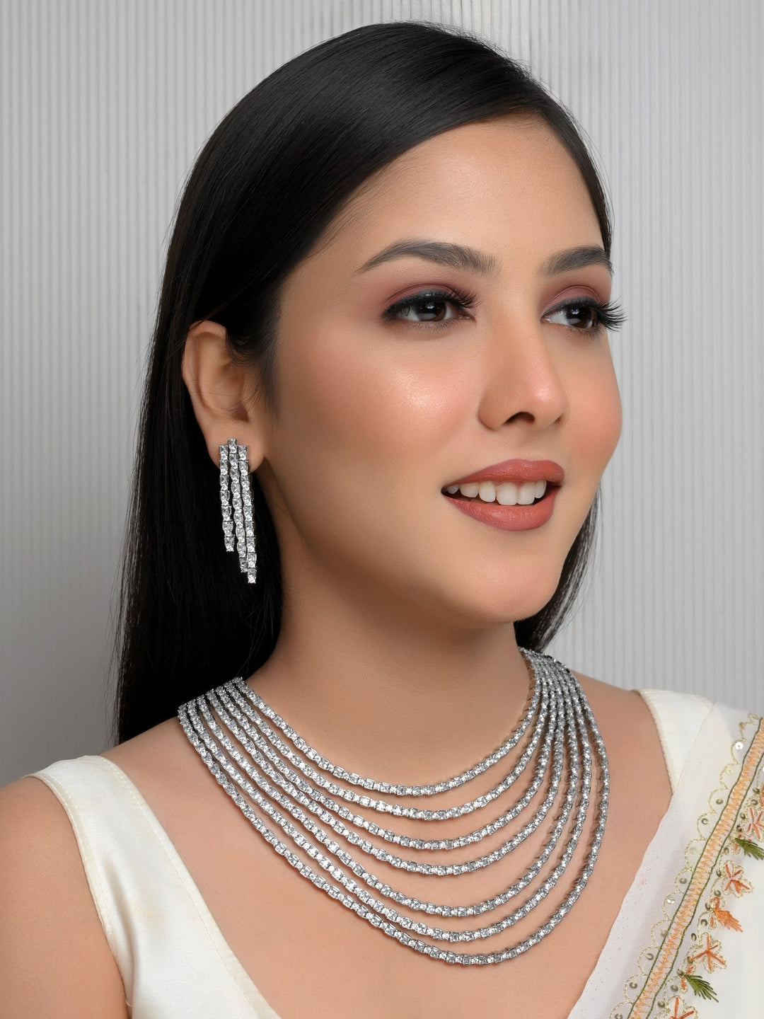 Silver plated brass metal necklace set with dazzling American diamond accents