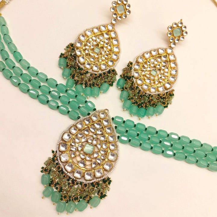 Gold plated pendant set with mint green stone and Pachi Kundan design