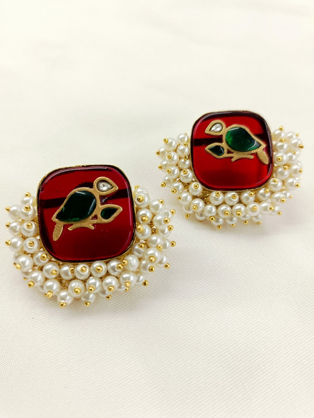 Elegant and stylish boutique top adorned with gold plated brass metal and pearl detailing