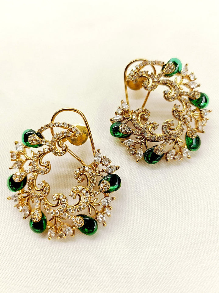 Add a touch of timeless elegance to your look with our Mantania Green Kundan Tops, featuring traditional craftsmanship, gold plated brass metal, and a delicate American Diamond Stones back clip-on Perfect for any occasion