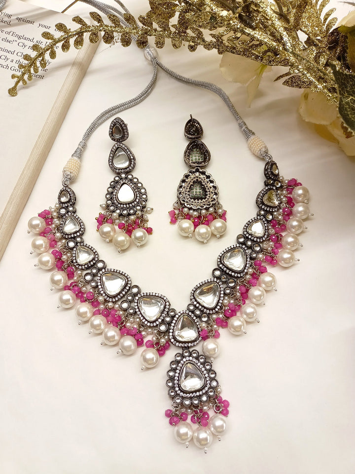 Exquisite Poornima Pink Kundan Necklace Set with intricate gold detailing and matching earrings
