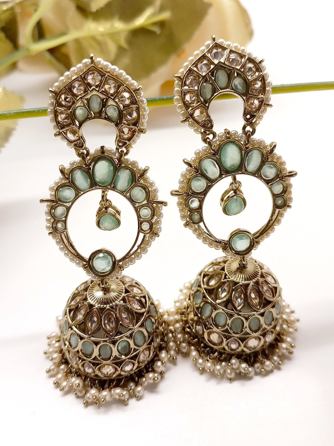 Gorgeous Marlee Mint Green Polki Jhumki earrings crafted from antique gold plated brass metal with stunning Polki Jhumki and pearl hanging
