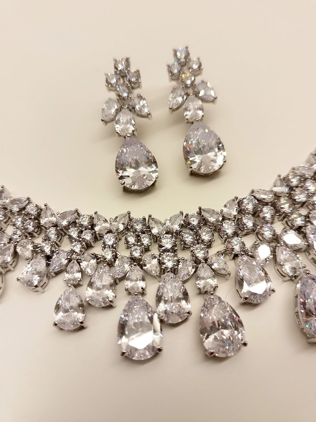 Gorgeous American Diamond Necklace Set adorned with silver plated brass metal, showcasing undeniable sparkle and brilliance, perfect for any special occasion