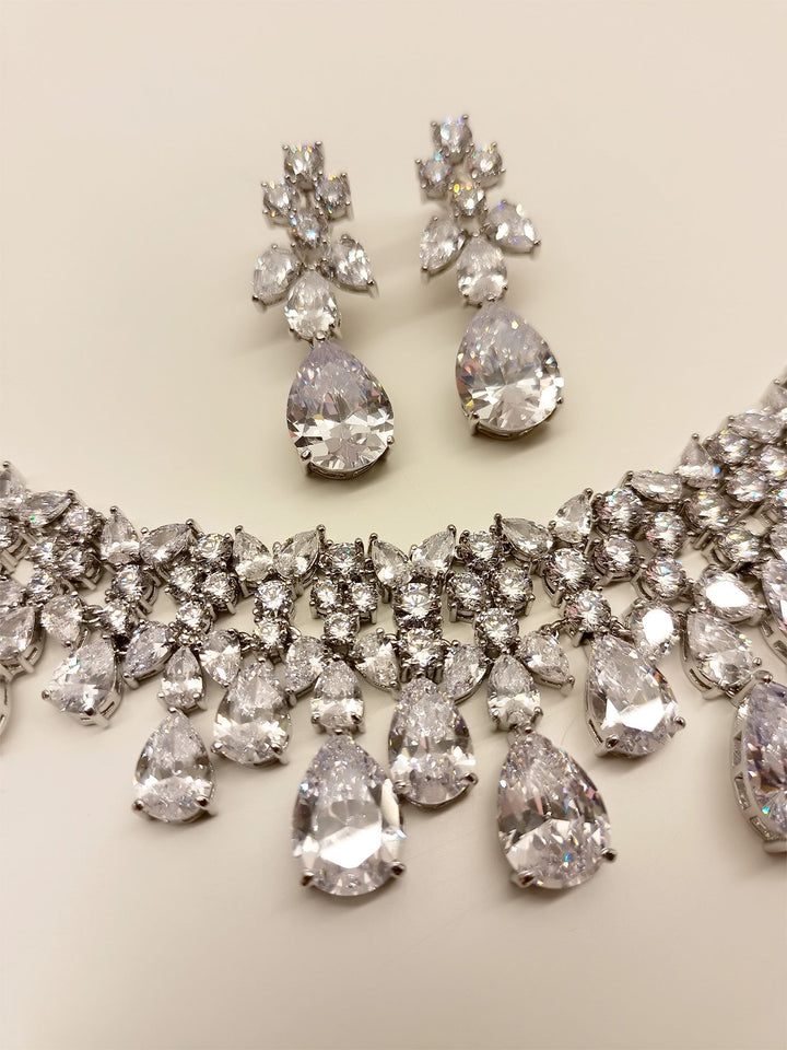 Gorgeous American Diamond Necklace Set adorned with silver plated brass metal, showcasing undeniable sparkle and brilliance, perfect for any special occasion