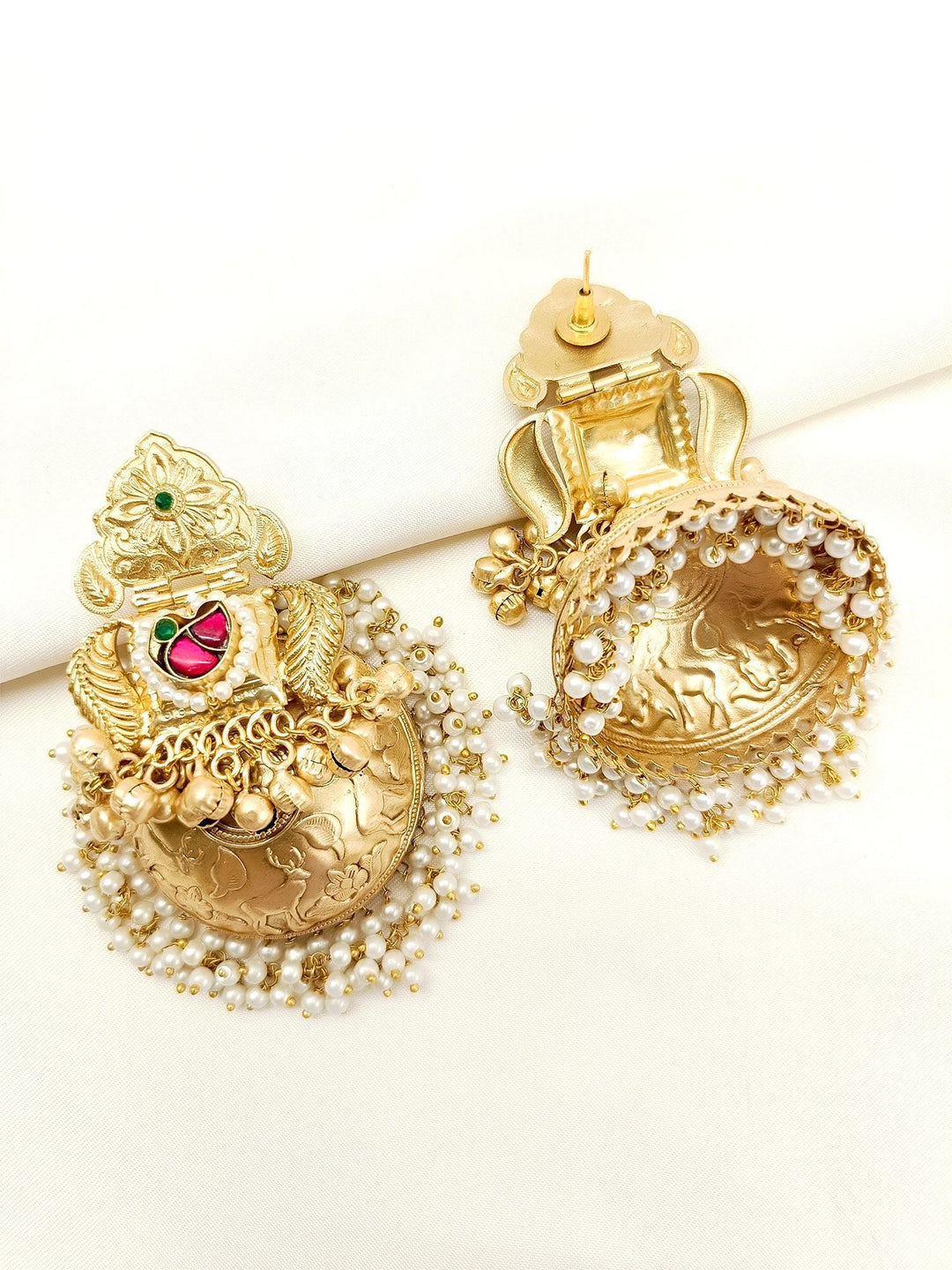  Elegant jhumki crafted from gold plated brass metal with delicate pearl hangings 