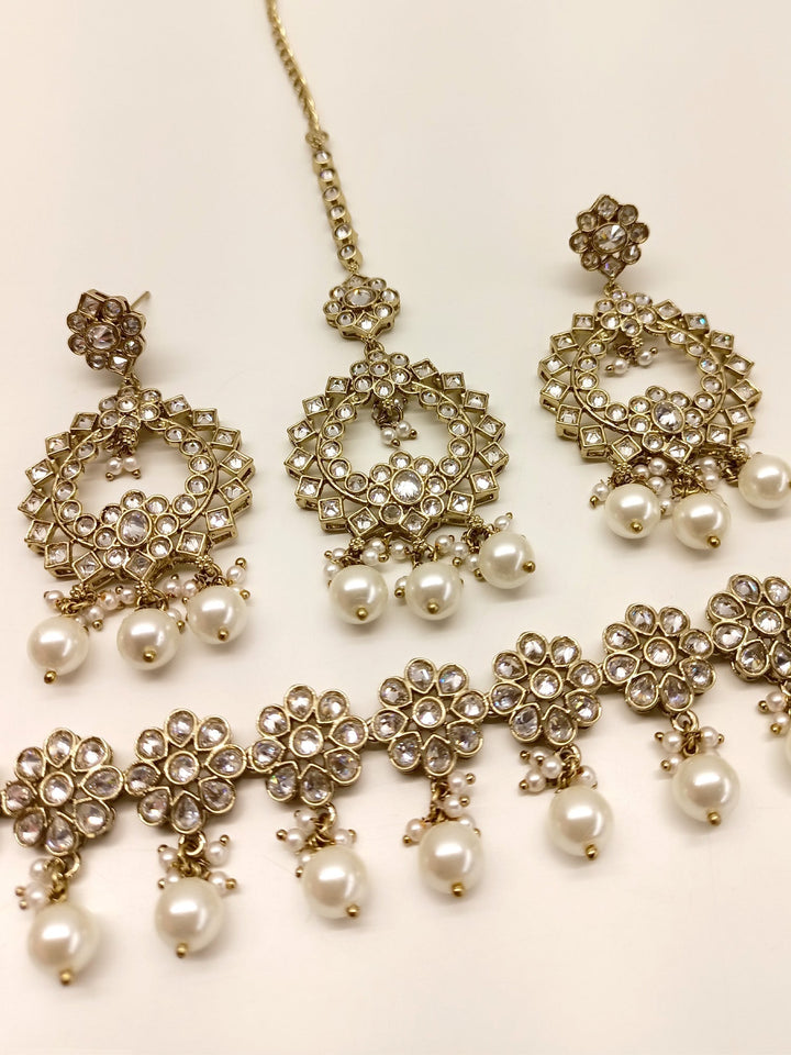 Anokhi White Polki Necklace Set with intricate design and sparkling stones