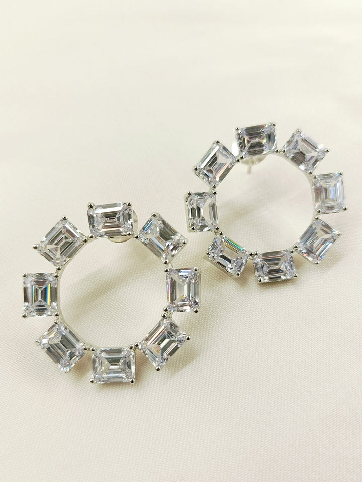 A pair of Avisha White American Diamond Tops with silver plated brass metal and genuine American diamonds, perfect for adding a touch of sparkle to any style

