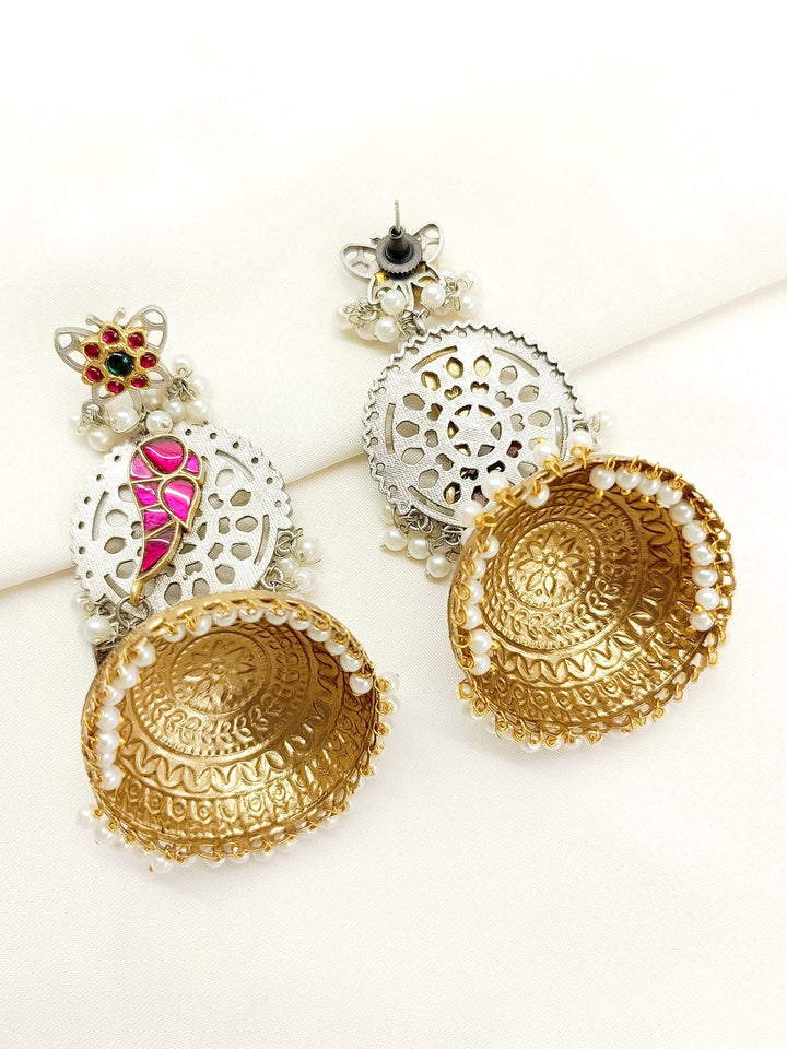  Elegant jhumkis adorned with delicate pearl hangings, perfect for special occasions