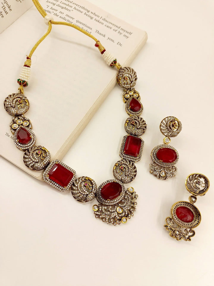 Refined detailing Maroon Victorian Necklace Set with American Diamond Setting in Antique Gold Plated Brass Metal