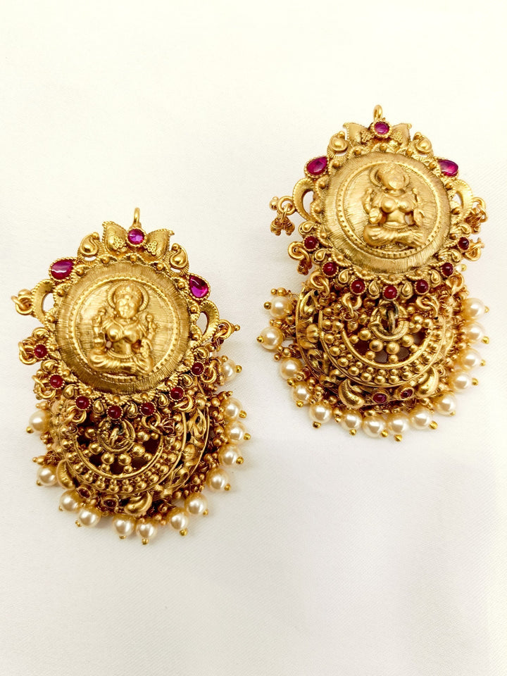  Close-up of antique jhumki earrings with detailed craftsmanship