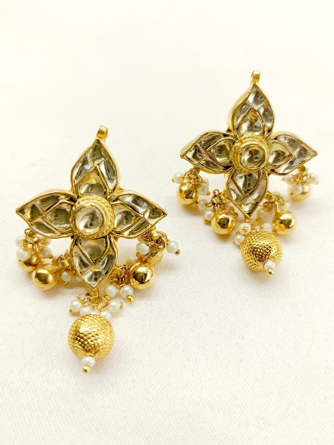 Gold plated Kundan tops with intricate off white detailing and elegant design