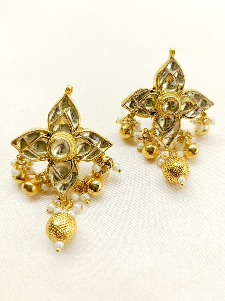 Gold plated Kundan tops with intricate off white detailing and elegant design