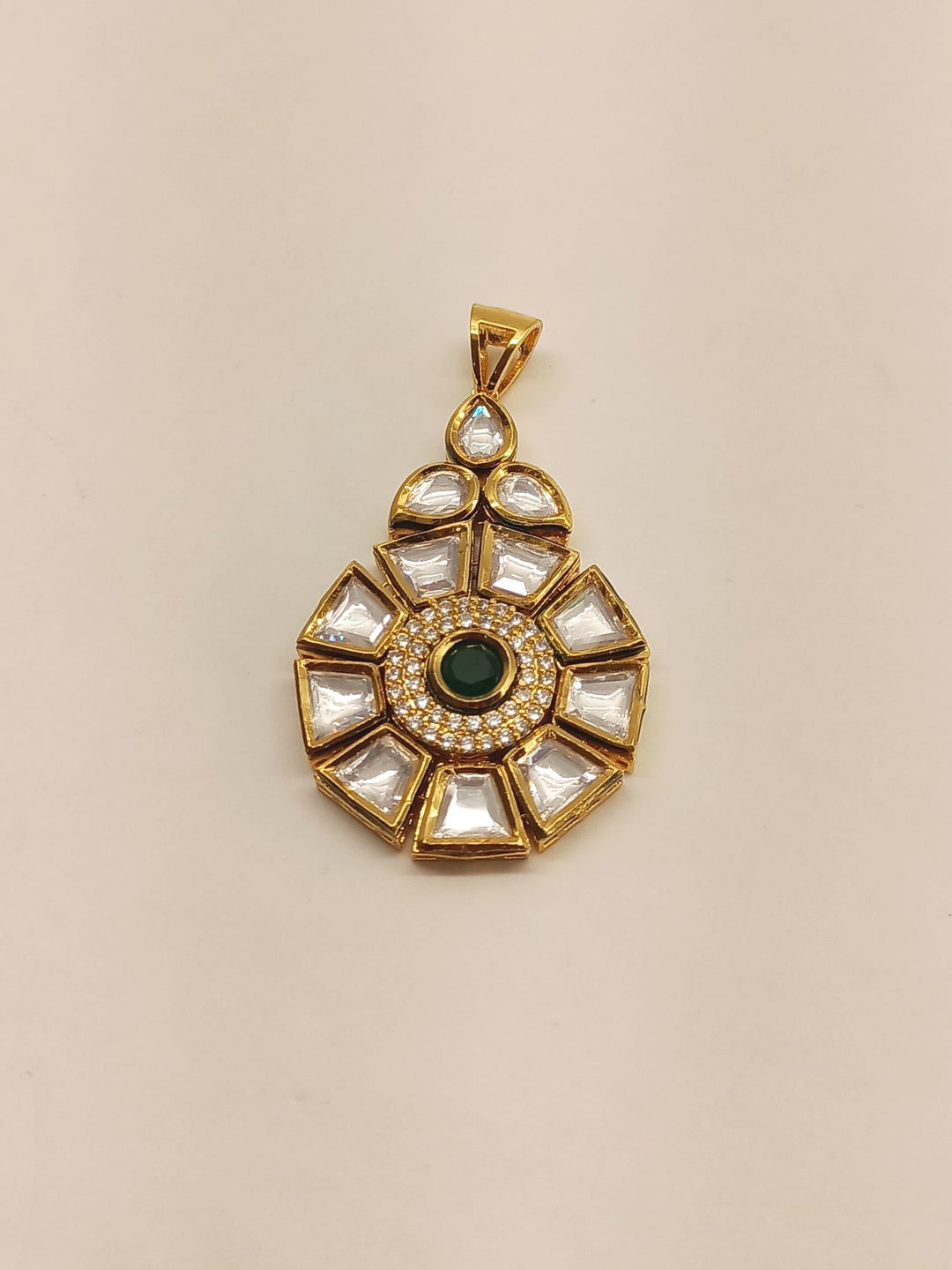Handcrafted green Kundan pendant set with intricate details and stunning design