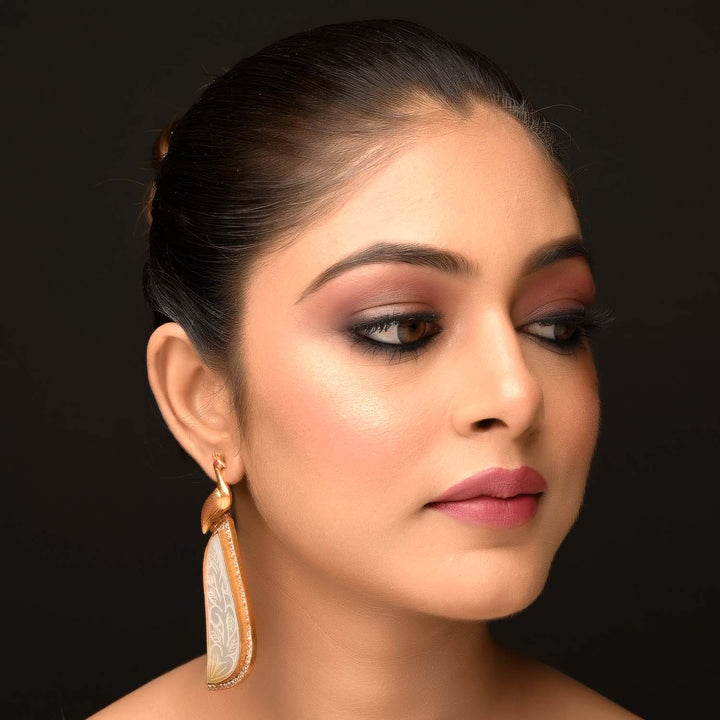 Aatmaja White Stone Peacock Gold Plated Boutique Earrings with intricate design and stunning details