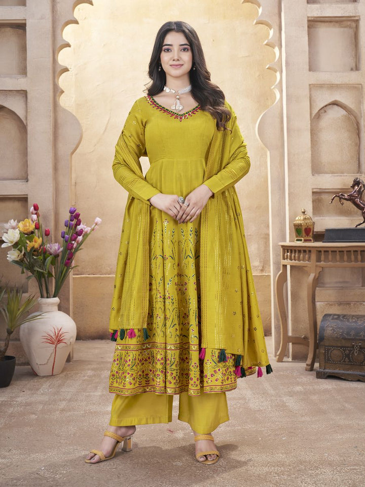 Yellow Roman silk mirror work and foil print salwar suit in size M-38 and XL-42 with top length of 50 inch and bottom length of 39 inch