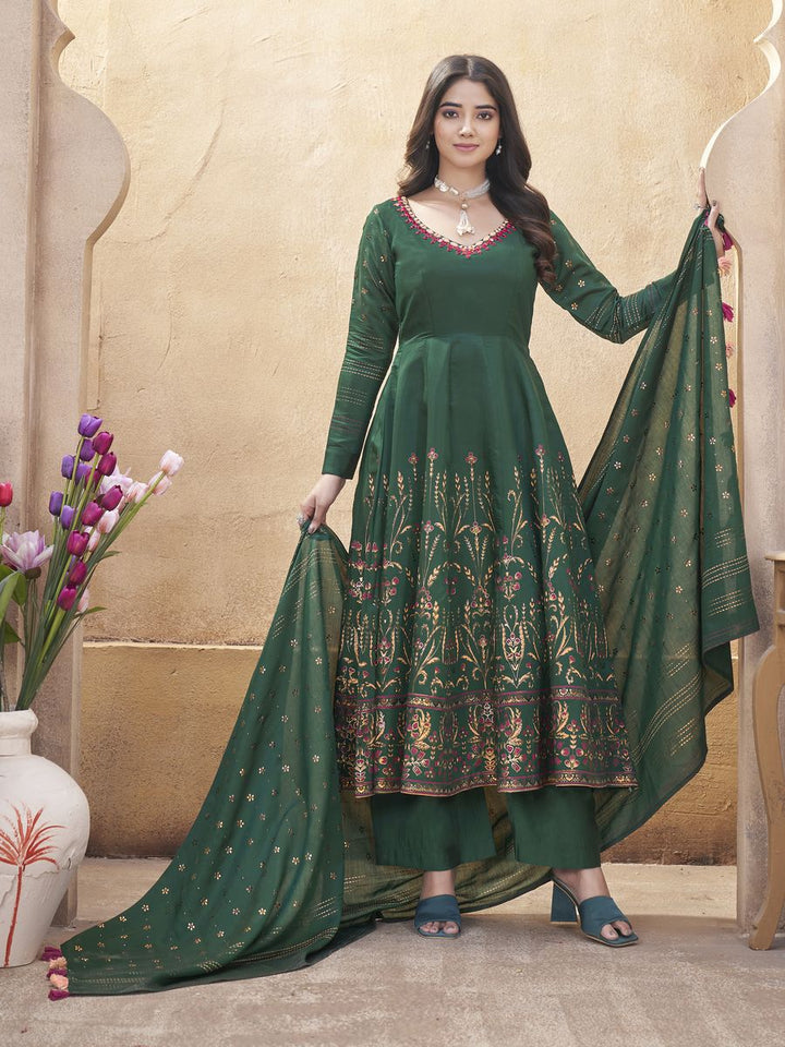 Green Roman Silk Mirror Work and Foil Print Salwar Suit, top made from Roman Silk, with mirror work and foil print, 50-inch length Bottom made from Roman Silk, 39-inch length Dupatta also made from Roman Silk, 230 MTR length