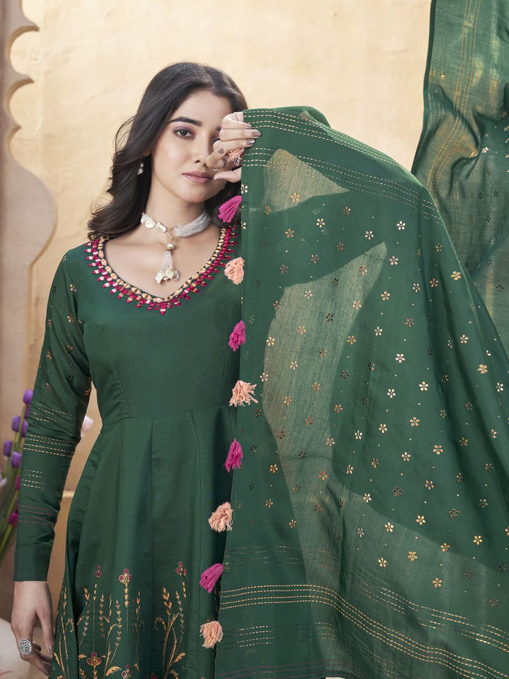 Green Roman Silk Mirror Work and Foil Print Salwar Suit, top made from Roman Silk, with mirror work and foil print, 50-inch length Bottom made from Roman Silk, 39-inch length Dupatta also made from Roman Silk, 230 MTR length