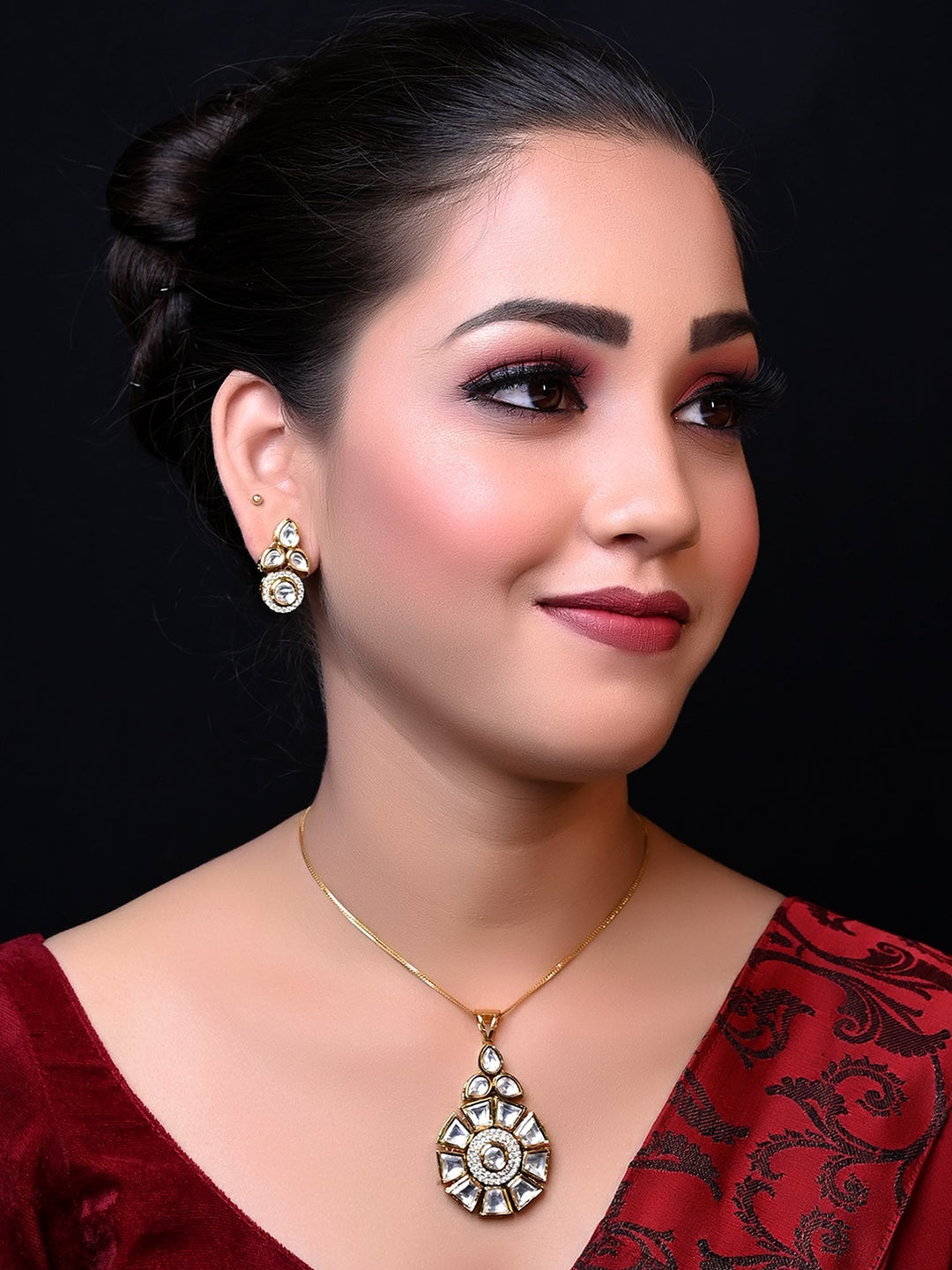 Beautiful Purnima White Kundan Pendant Set with intricate Kundan setting and brass metal base with gold plating