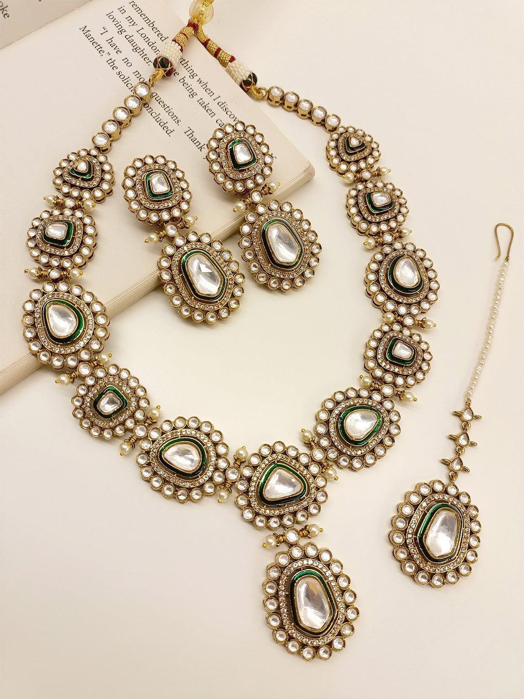  Exquisite Green Polki Necklace Set, crafted from high quality antique gold plated brass metal, adorned with beautiful pearls and American diamond setting, the ultimate decoration for an unforgettable bridal experience