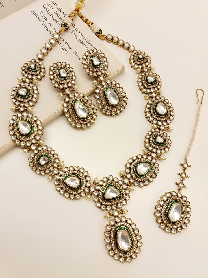  Exquisite Green Polki Necklace Set, crafted from high quality antique gold plated brass metal, adorned with beautiful pearls and American diamond setting, the ultimate decoration for an unforgettable bridal experience