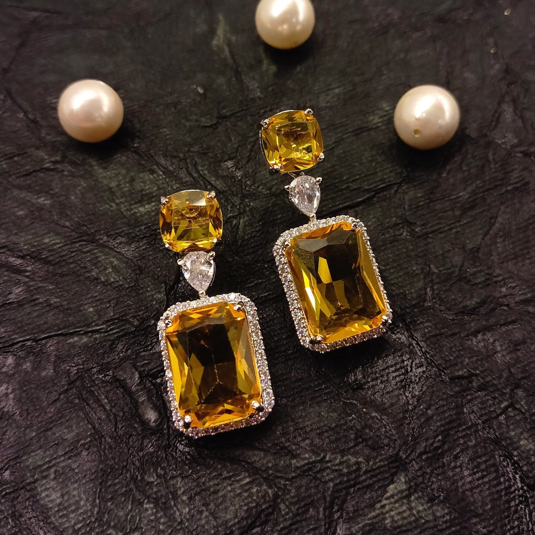  Gorgeous silver-plated earrings with yellow color stone and AD