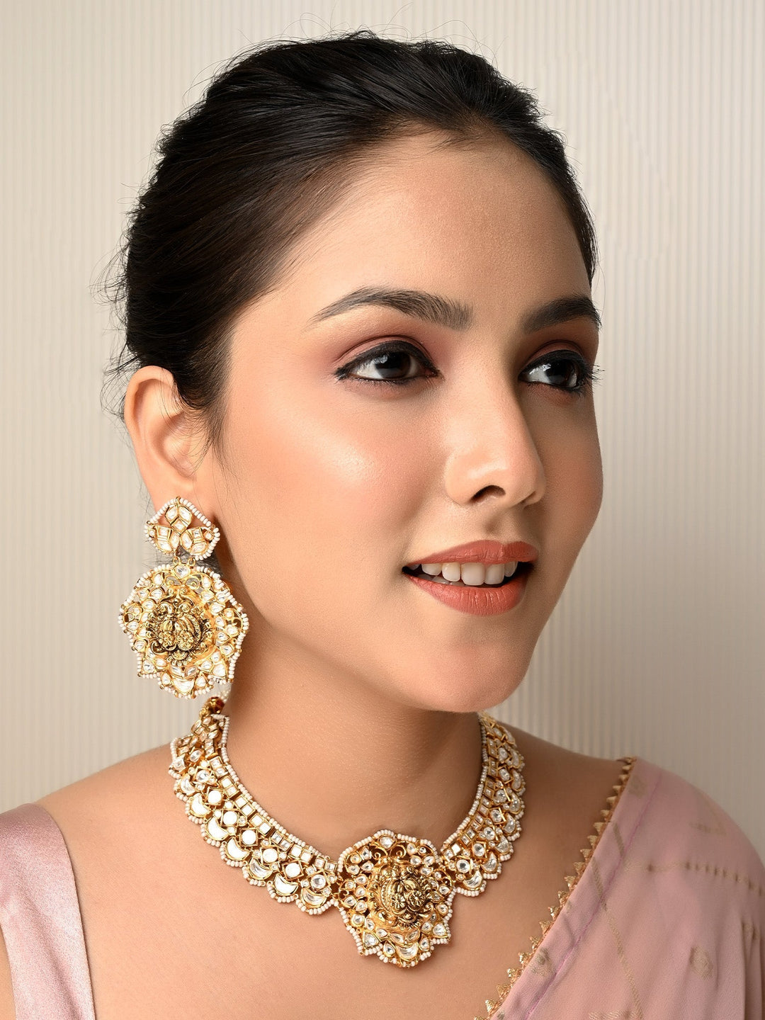 Exquisite Aamaal Kundan Necklace Set with intricate gold detailing and colorful gemstones
