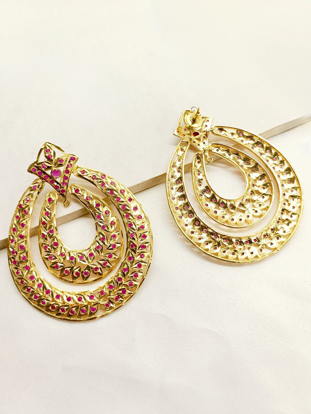 Elegant traditional Jadau earrings with intricate craftsmanship
