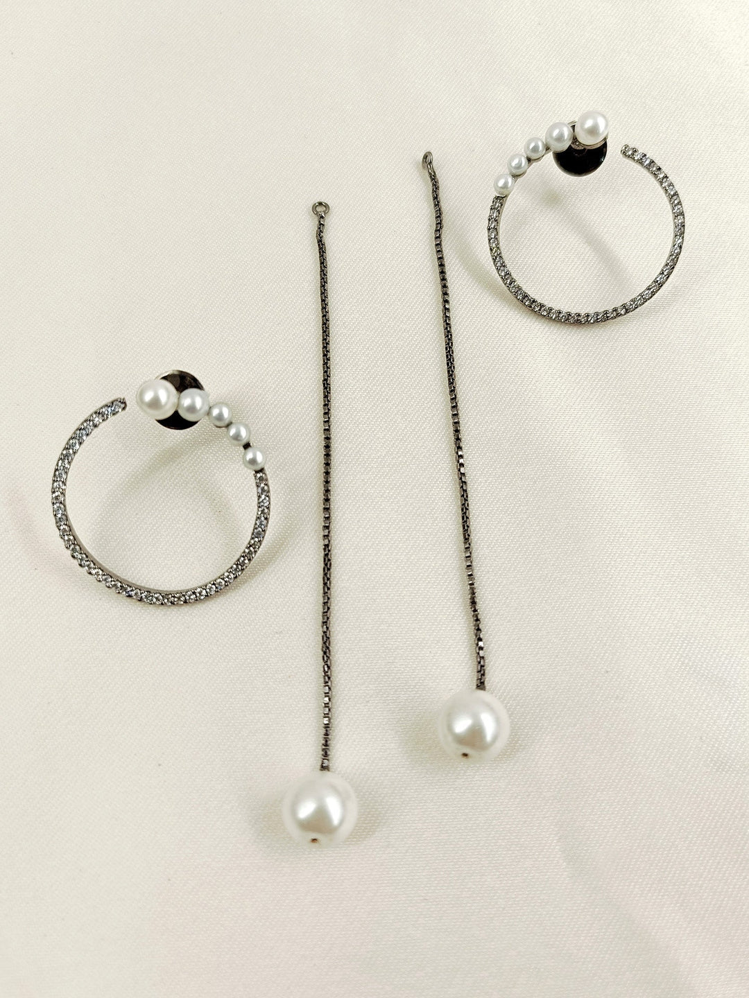 Delicate pearl detailing adds sophistication and charm to the earrings