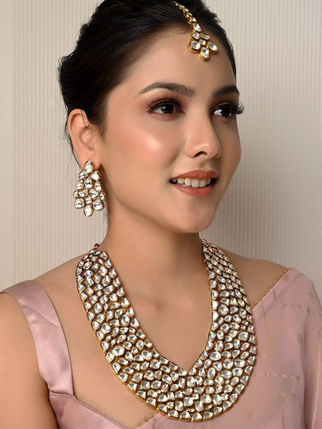 Exquisite gold and green Sanober Kundan Necklace Set with intricate detailing