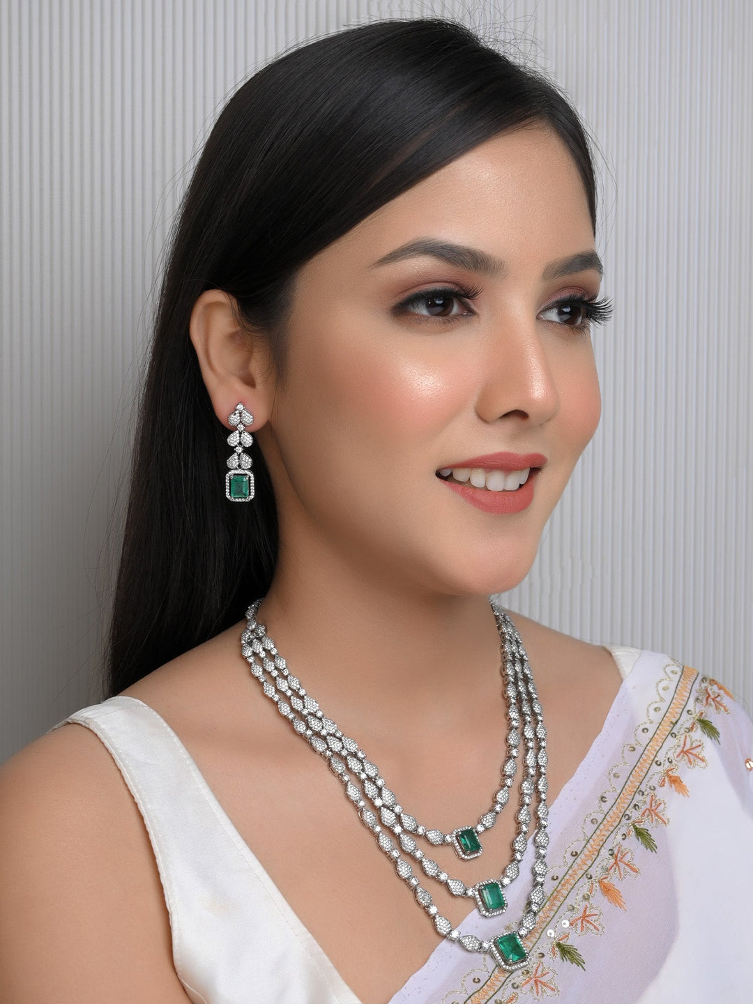 Silver Plated American Diamond Necklace Set With Semi Precious Emerald Stone Based On Brass Metal