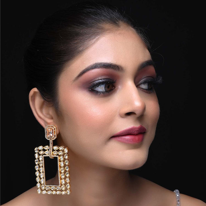 Close up of Kasturi Copper Stone Gold Plated Kundan Polki Earrings with American Diamond and Kundan-polki stones 