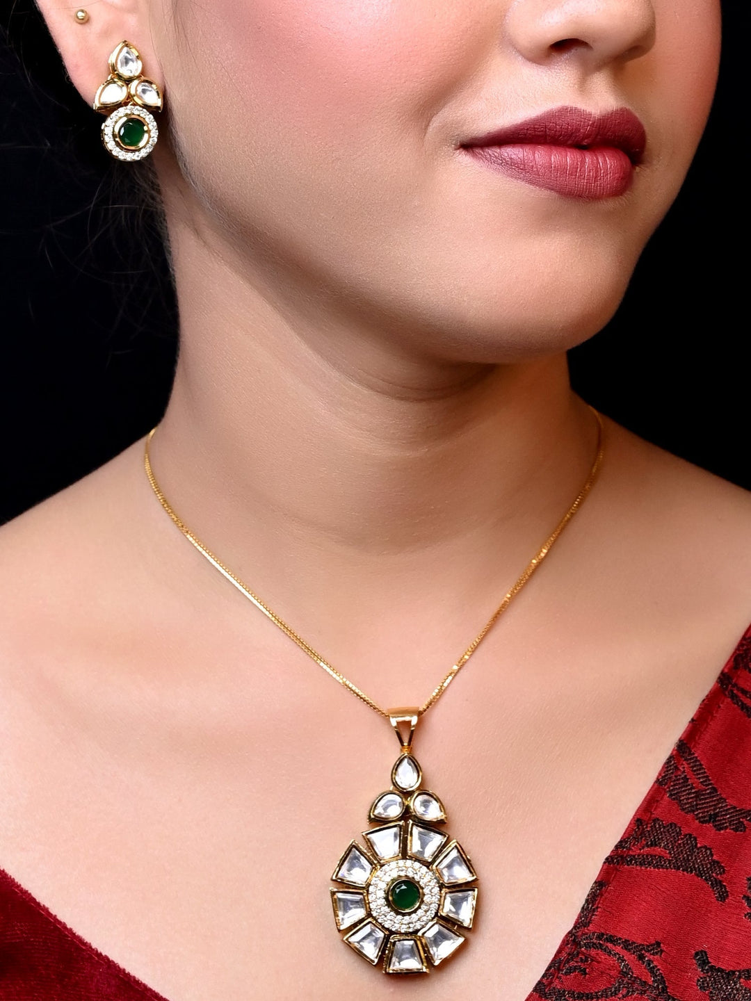 Beautiful Ragvi Green Kundan Pendant Set with intricate detailing and stunning design