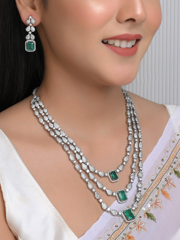  Three-layered silver plated necklace with emerald stone and small earrings